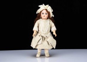 A late 19th century French bebe impressed M G on Jumeau body,