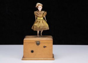 An 19th century clockwork dancing girl on musical box,