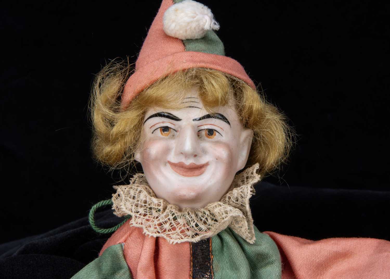 An unusual bisque headed squeak toy clown, - Image 2 of 2