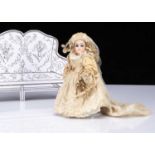 A small German bisque headed bride doll,