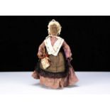 An unusal 19th century English wooden Folk Art elderly lady doll,