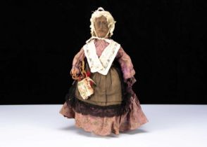 An unusal 19th century English wooden Folk Art elderly lady doll,