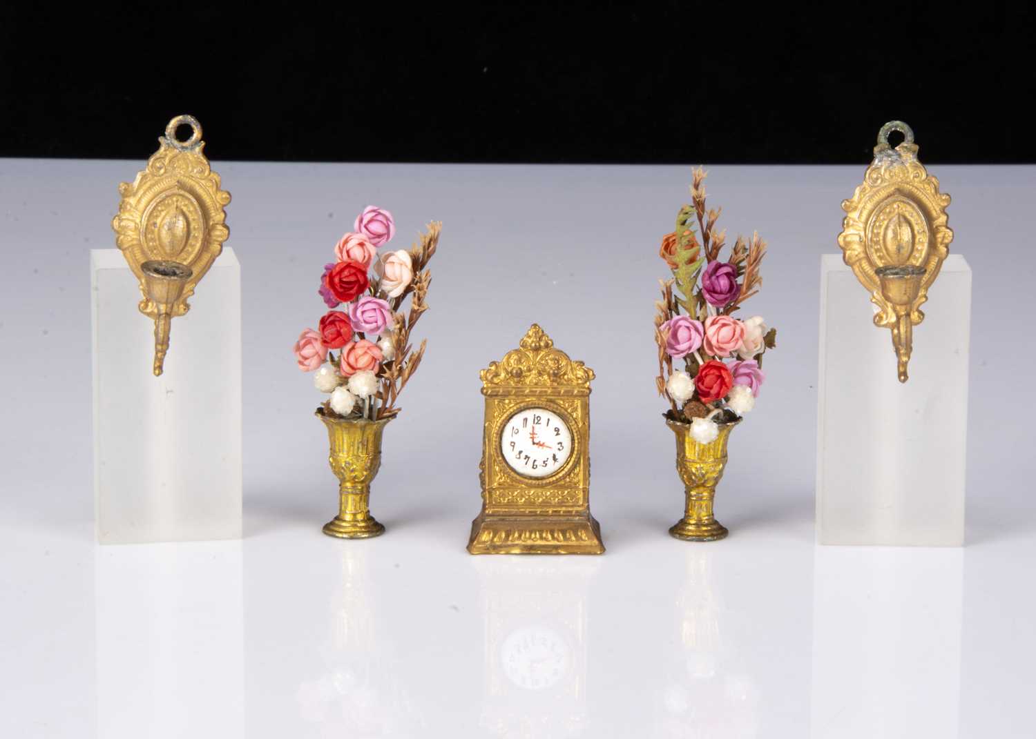 A German gilt-metal dolls’ house mantel clock,