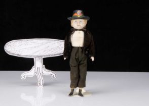 A unusual 19th century papier-mâché boy doll with moulded hat,