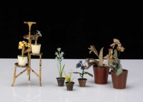 Three Viennese cold painted bronze dolls’ house flowers in pots,