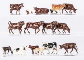 A lot of lead farm bovine animals comprising Britains standing (4) lying (5) and feeding (8) cows,
