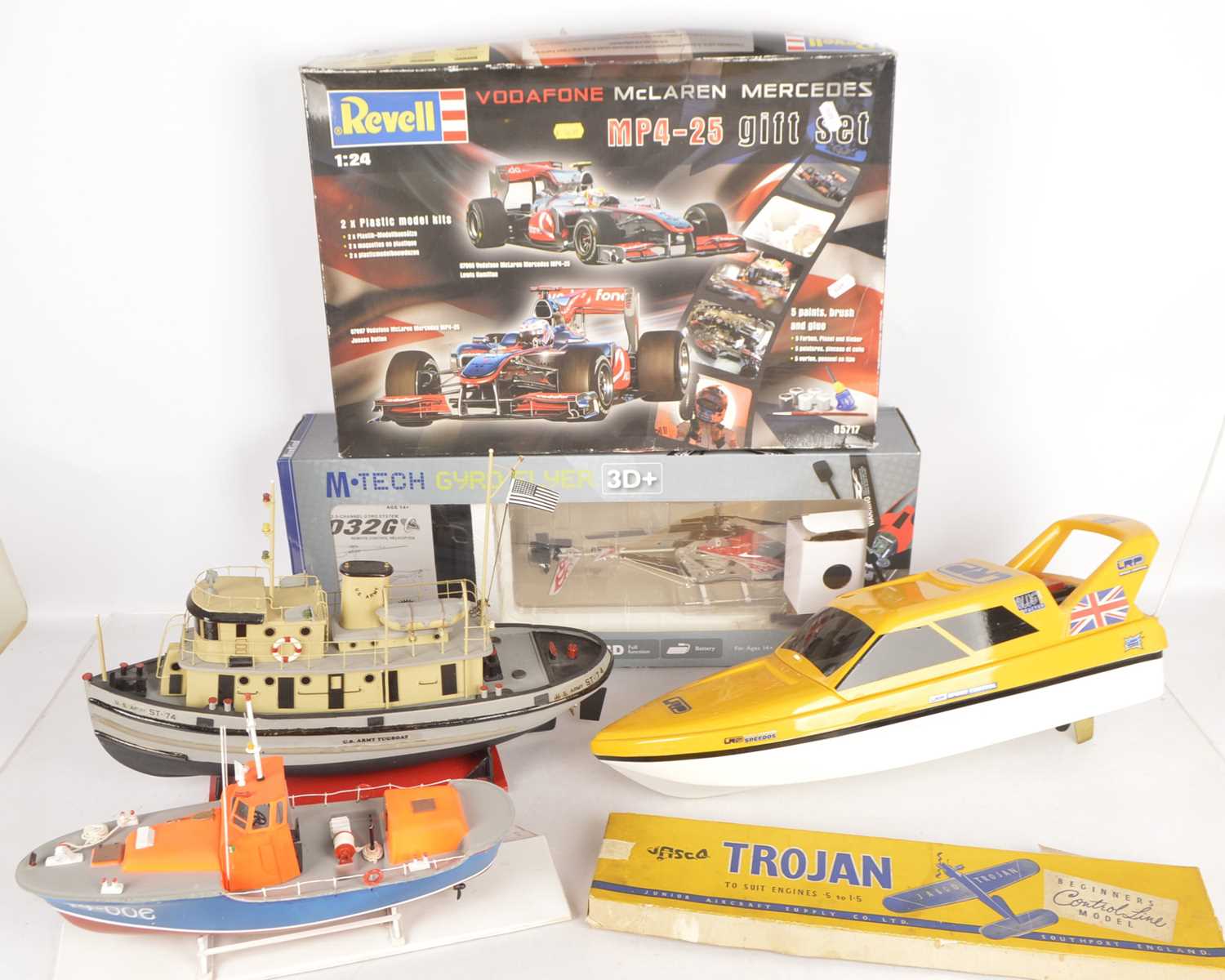 Radio Controlled Boat and Helicopter with various Accessories and Revell car kits and Balsa Airplane