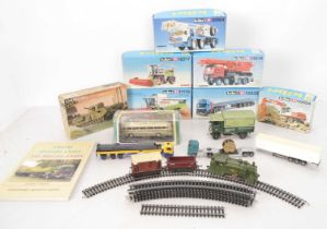 Kibri and other plastic kits in original boxes with vehicles and clockwork train (12),