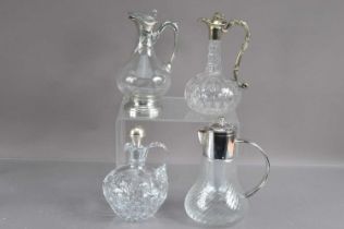 Four various claret or wine jugs,