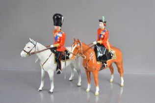 A pair of Beswick commemorative equestrian chines figurines of HRH Queen Elizabeth II and HRH The Du