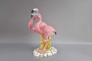 A mid-20th Century pottery model flamingo group,