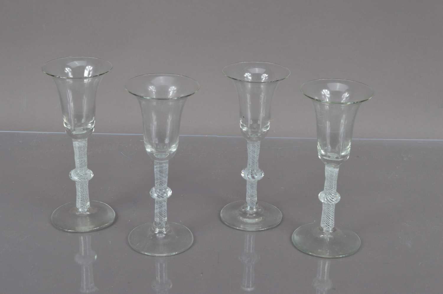 Four late Georgian glass drinking glasses,