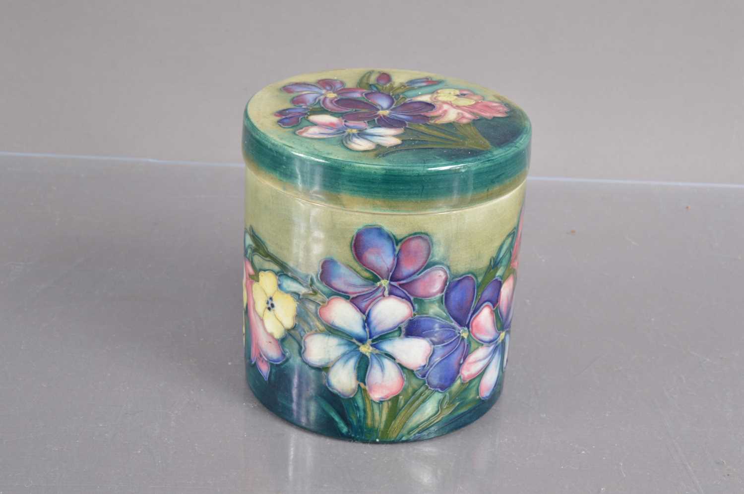 A Moorcroft lidded jar in 'Freesia' pattern circa 1930,