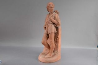 A Victorian Watcombe Pottery moulded terracotta statue of the young "Dick Whittington",