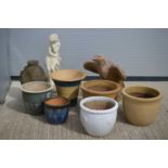 A group of glazed terracotta garden pot and various ornaments,