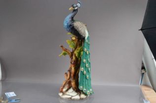 A very large mid-20th Century pottery model of a peacock,