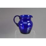 A good antique 19th Century hand-blown 'Bristol Blue' glass jug,