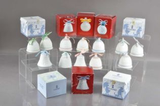 A collection of twenty Lladro Christmas collector's bells and baubles,