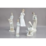 Four Lladro figures and a Nao example,