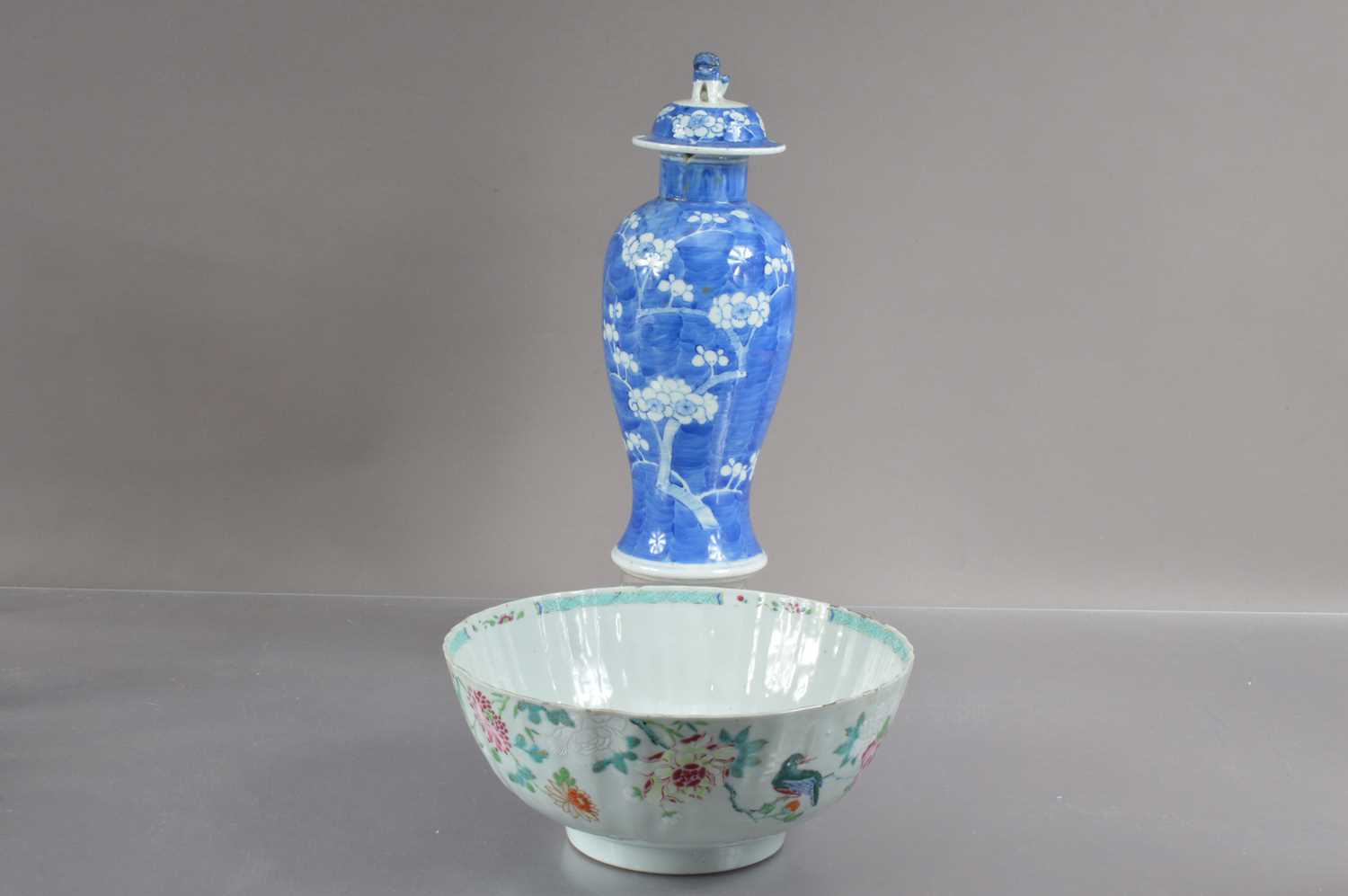 A Chinese Qin dynasty famille rose bowl with fluted sides decorated with birds and peonies,