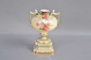 A Royal Worcester twin handled pedestal urn shape blush ivory vase,