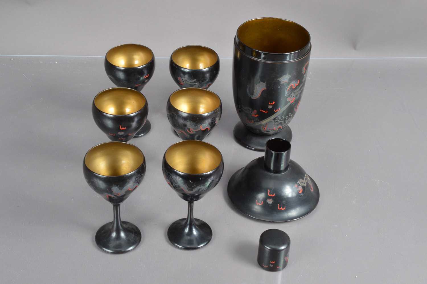 A Chinese lacquer Art Deco era cocktail set with a cocktail shaker and six matching goblets, - Image 2 of 2