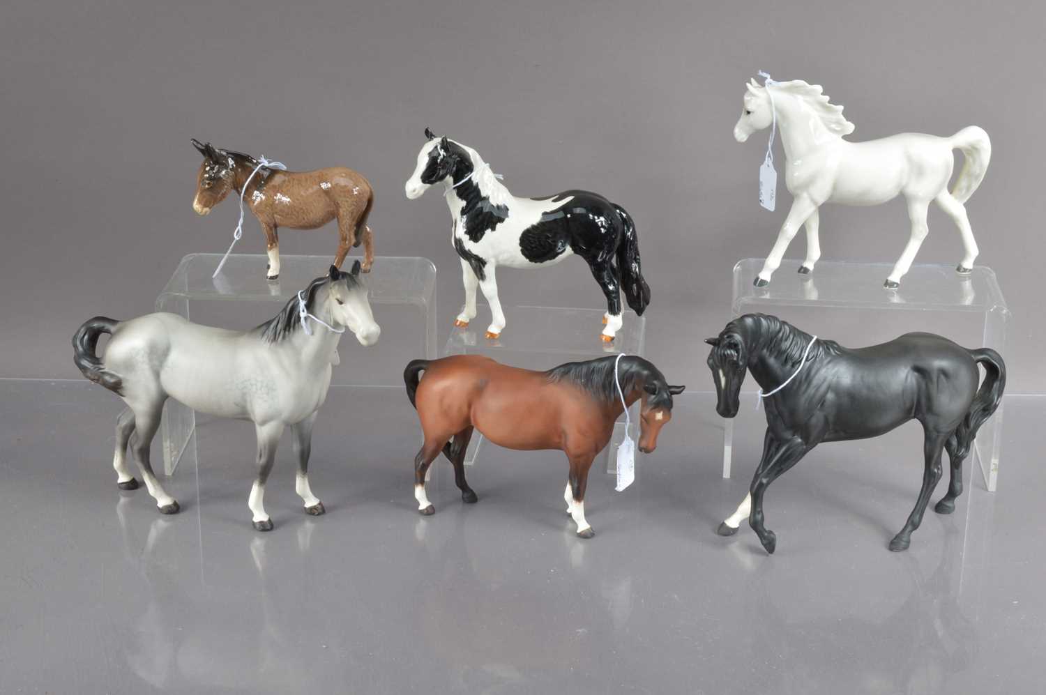 A group of five Beswick pottery horses and a donkey and one Japanese pottery horse,