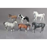 A group of five Beswick pottery horses and a donkey and one Japanese pottery horse,