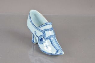 An 18th Century style blue and white Delftware shoe,