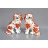 A good pair of small-sized antique Staffordshire pottery spaniel dogs,