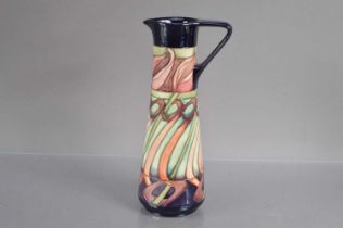 A Moorcroft Pottery "Tulip Weaver" trial ewer shape vase dated 19-5-10,