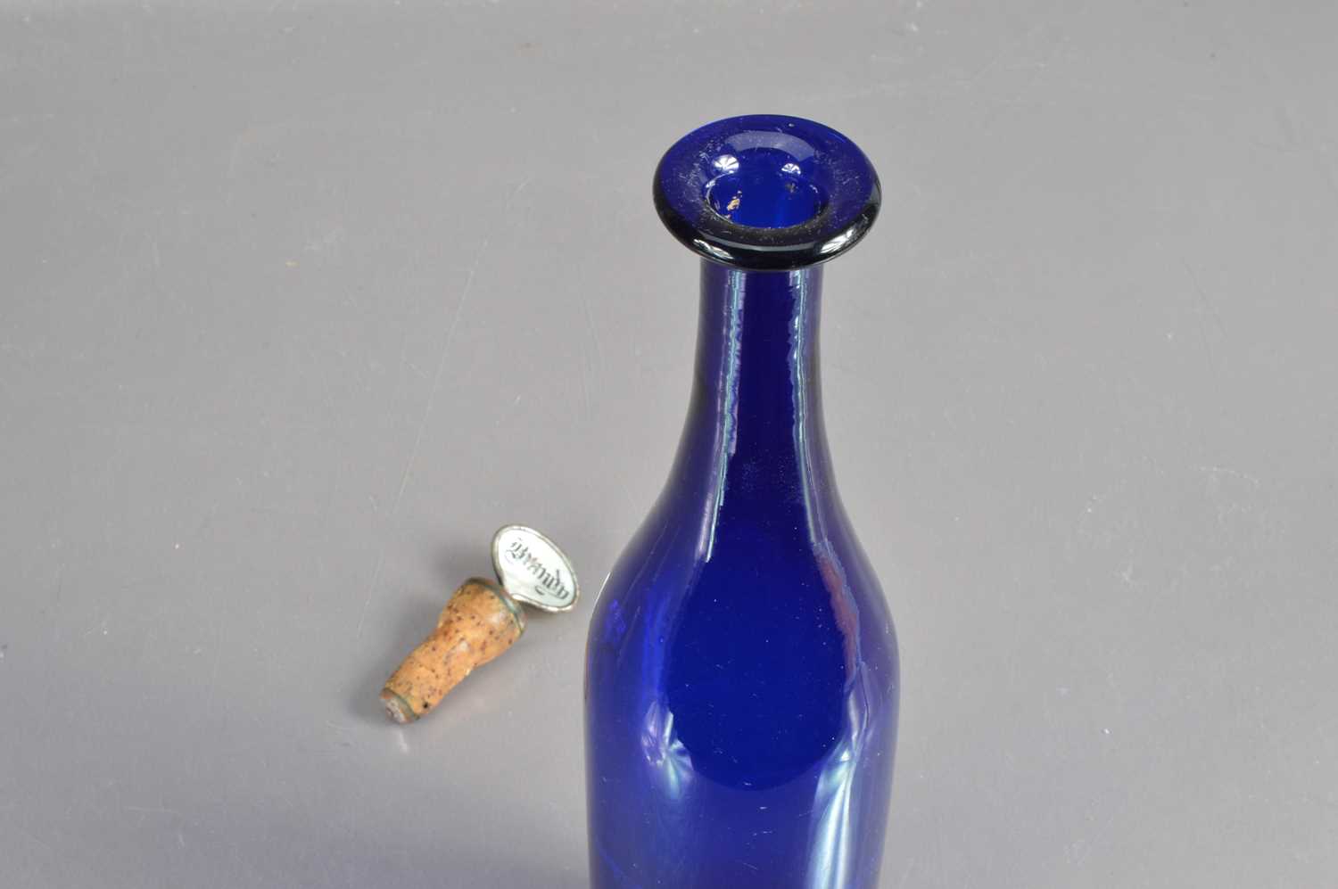 A 'Bristol Blue' glass bottle-shape decanter with silver plated 'Brandy' label stopper, - Image 4 of 4