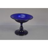 A small "Bristol Blue" glass tazza or shallow footed bowl,