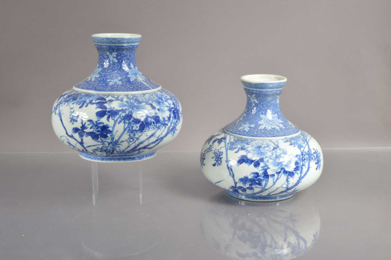 A pair of 19th Century Japanese blue and white Seto or Arita squat-shaped vases,