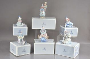 Six Lladro porcelain clown figures modelled in various positions,