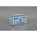 A Delft style blue and white pottery flower brick,