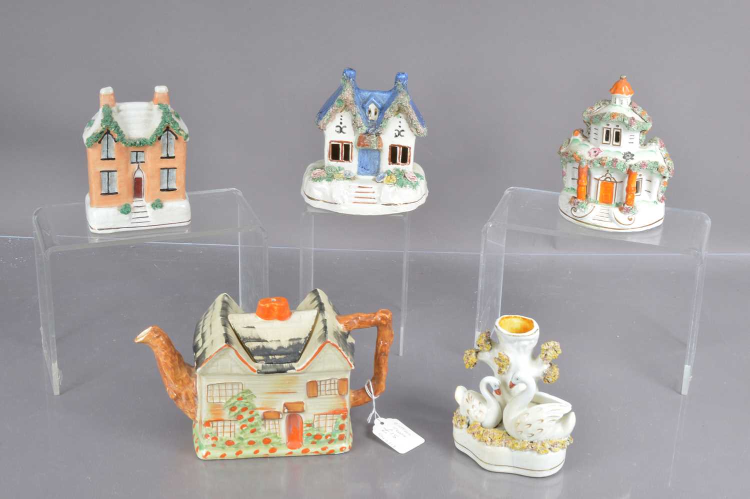 Five Staffordshire pottery items,
