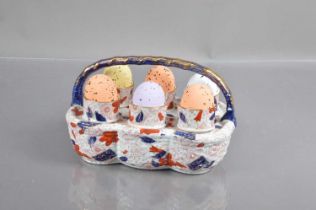 A Victorian Staffordshire pottery egg cup basket,