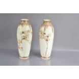 A pair of art nouveau style Japanese Meiji period Satsuma earthenware vases,