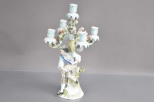 A late 19th-early 20th Century Sitzendorf German porcelain candelabra modelled with shepherd shearin