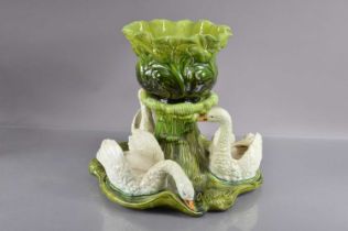 A late 19th or early 20th Century Bretby majolica pottery jardiniere and stand centrepiece,