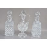 A high quality lead crystal claret jug and a pair of cut crystal whisky or liqueur decanters,