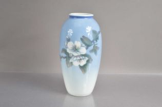 A Royal Copenhagen vase decorated with floral branch and butterfly,