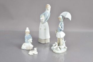 A group of Lladro figurines,