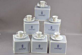 A set of six Lladro demitasse animal puppy and kitten coffee cups and saucers,
