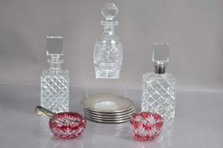 Three mid-20th Century decanters including Waterford Crystal "Castletown" pattern and German silver