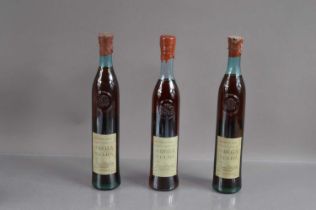 Three bottles of Adega Velha Brandy,