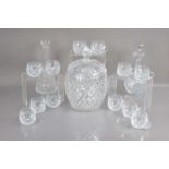 A very good lead crystal cut glass punch bowl and cover with twelve matching cups,