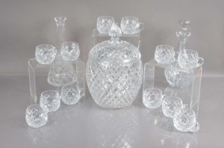 A very good lead crystal cut glass punch bowl and cover with twelve matching cups,