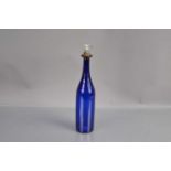 A 'Bristol Blue' glass bottle-shape decanter with silver plated 'Brandy' label stopper,